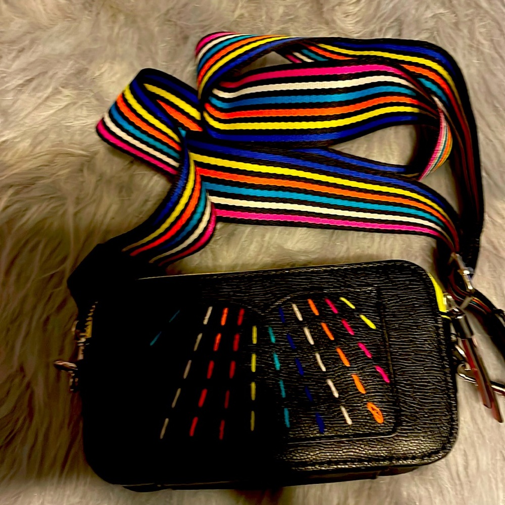 Non leather material 
Multi print one size purse
